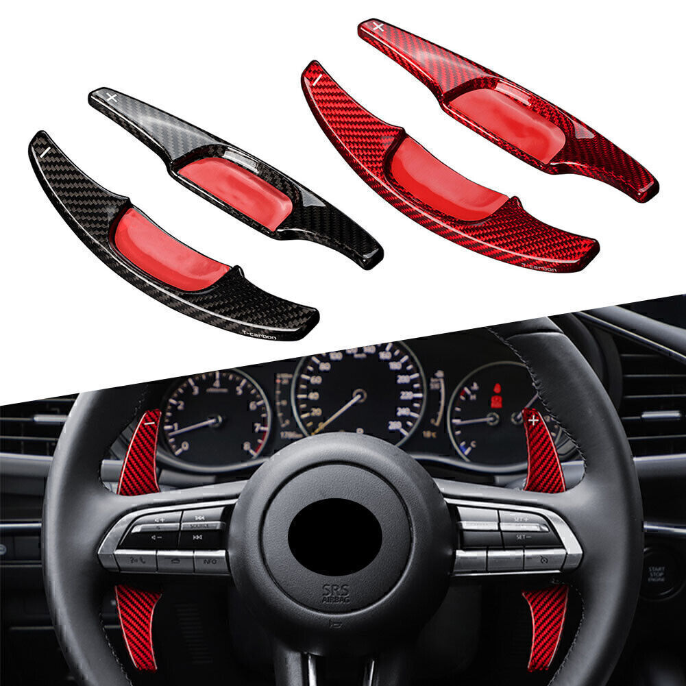 Extended carbon fiber steering wheel paddle shifters suitable for Mazda 3 2020 and 2021 models.
