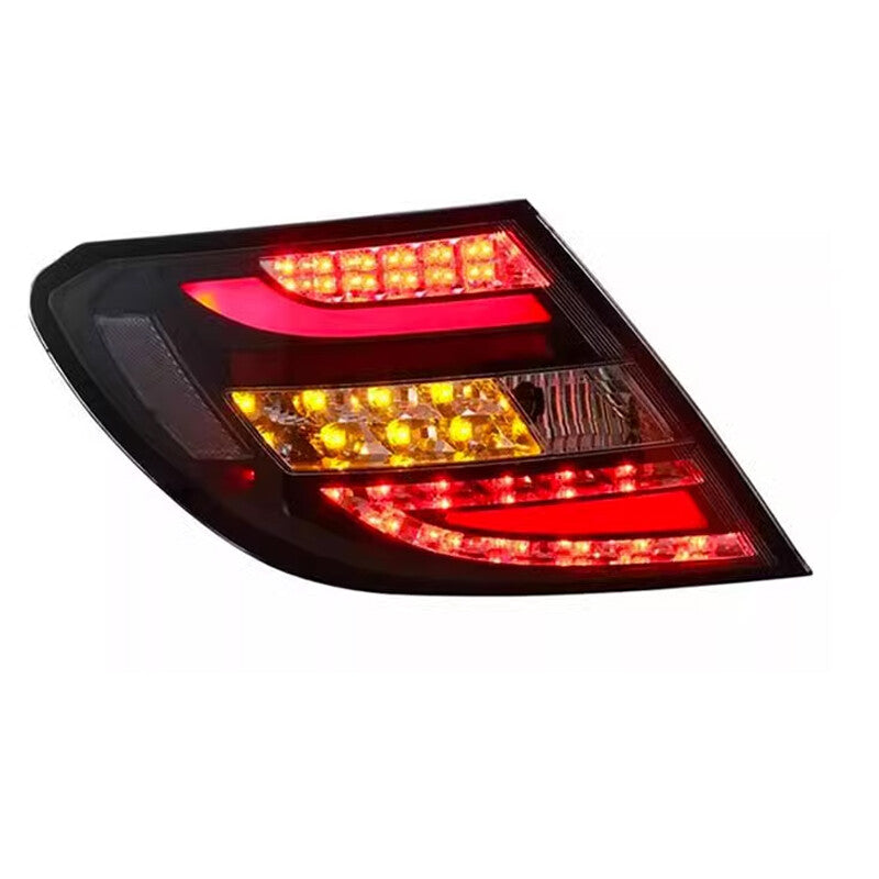 A pair of black LED Perform taillights for Mercedes W204 C-Class 2011-14.