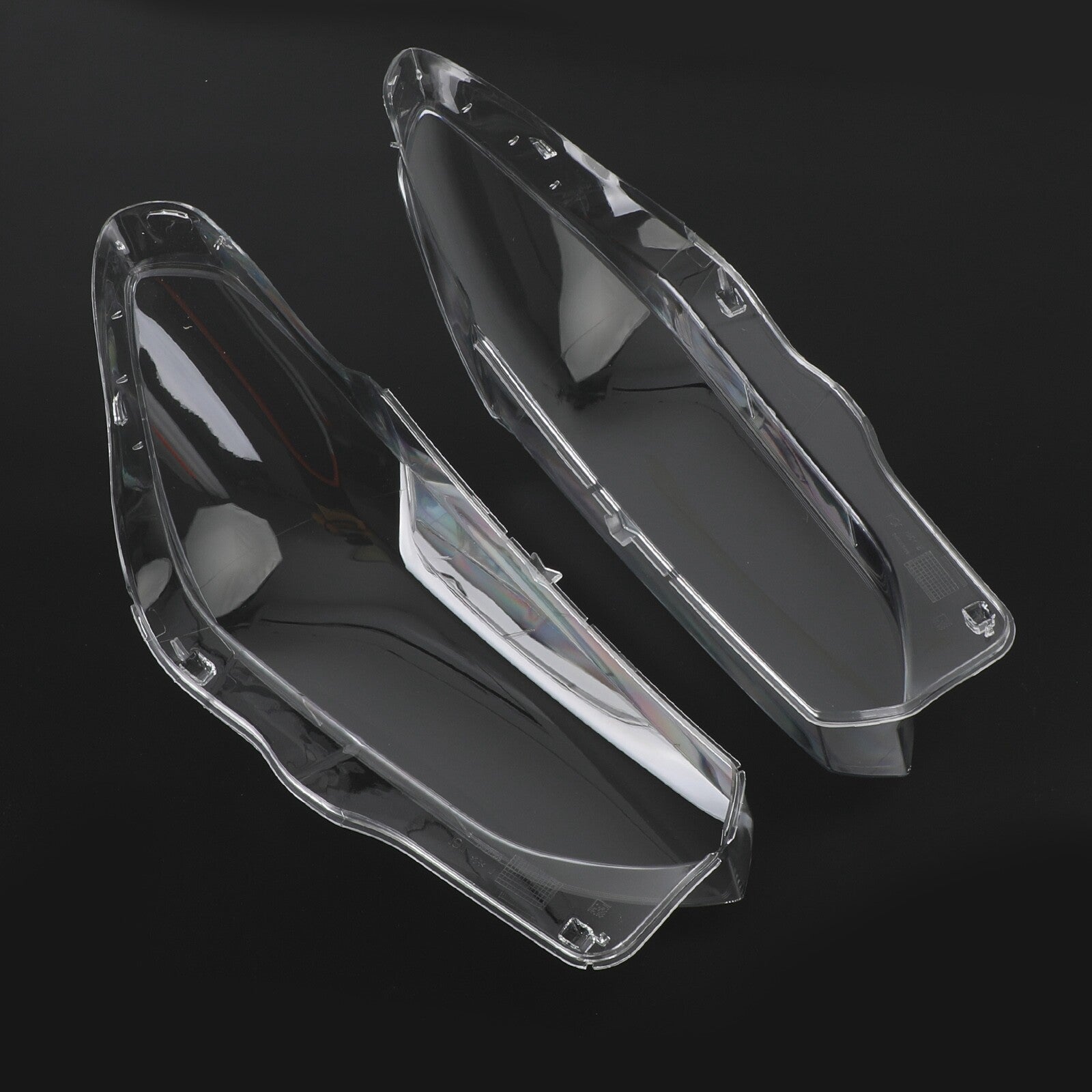 A pair of transparent headlight lens replacement covers for BMW X3 X4 G01 G02 G08 2018-2021