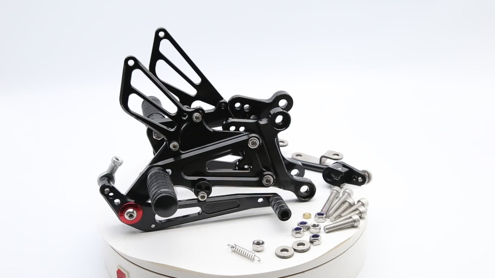 Adjustable black CNC gear footrest set for RS125 2T 2001 - 2013
